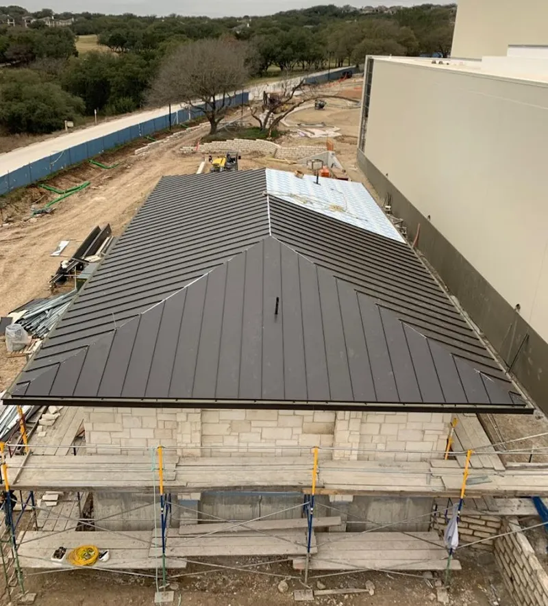 Metal roof new construction with scaffolding in Northbridge