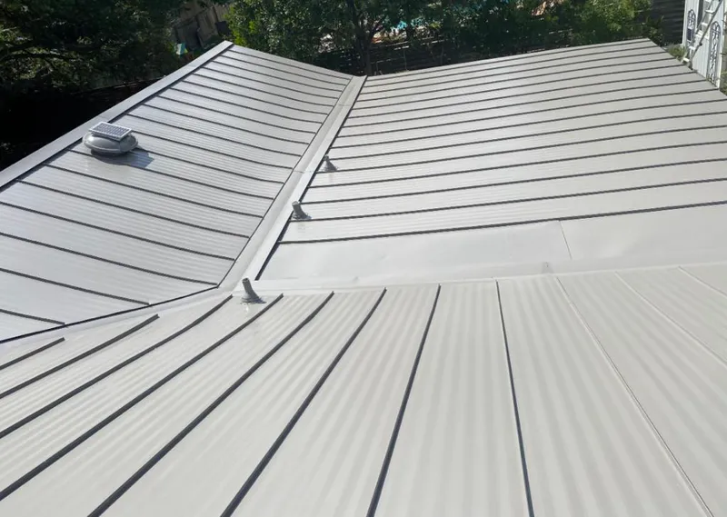 Solar attic fan installed on a metal roof for Roof Ventilation in Northbridge